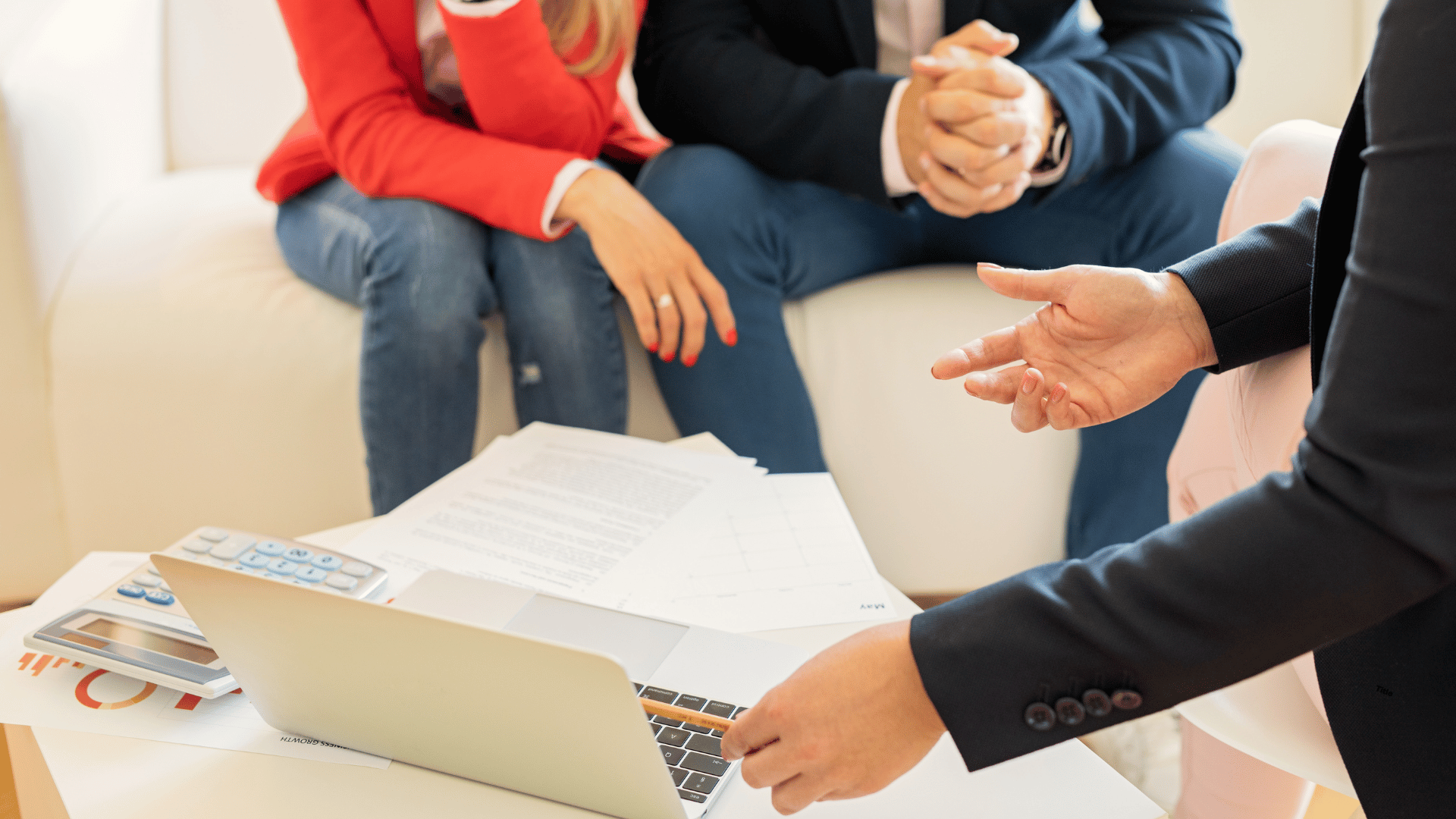 mana and woman receiving financial consultation and advice in front of laptop