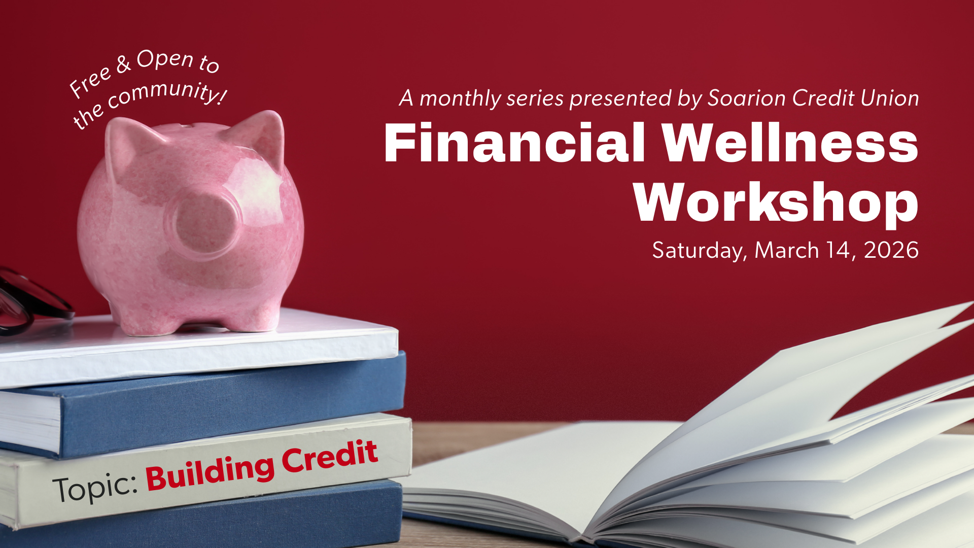 Piggy bank on top of financial wellness books with one book laid open on the side