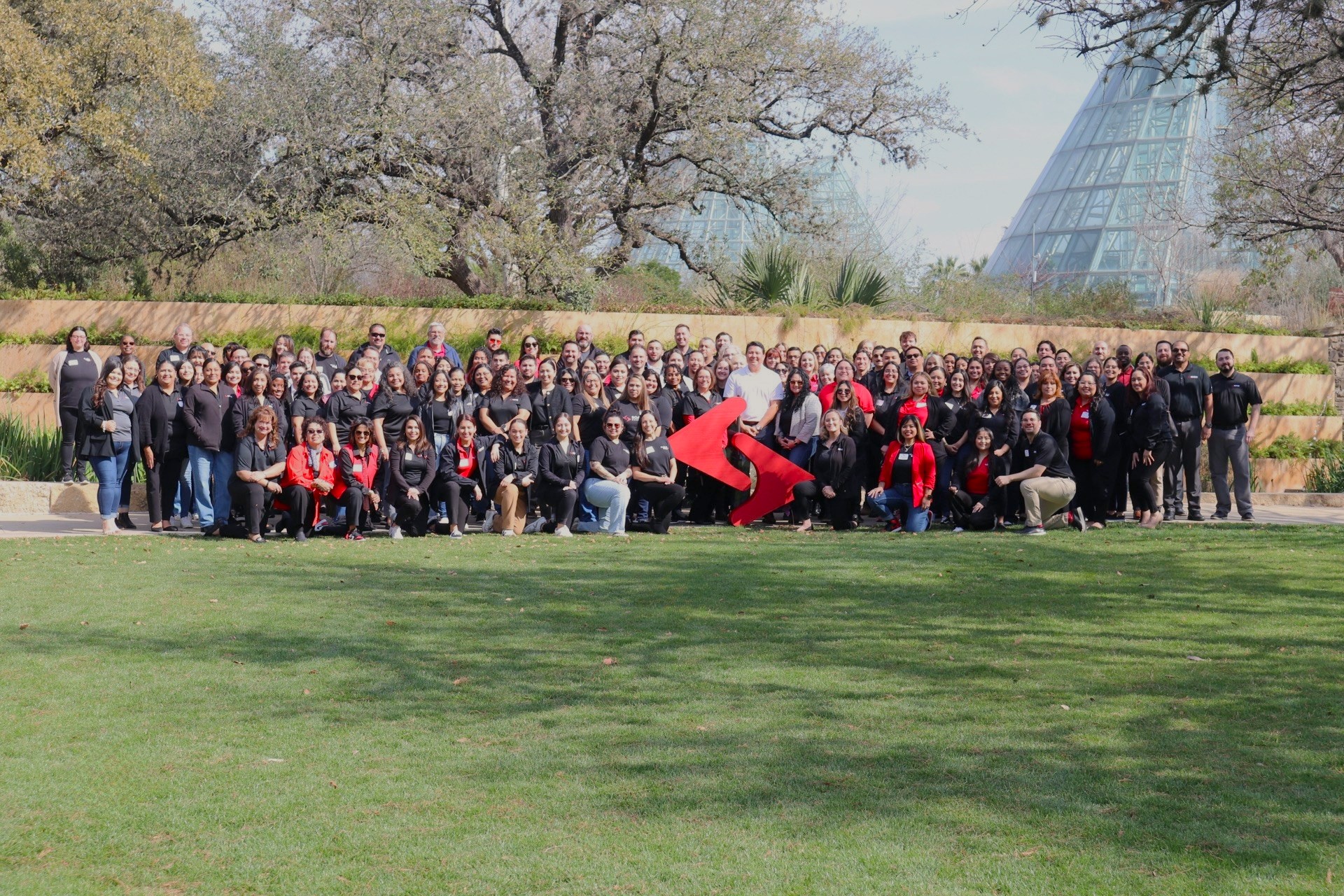 Group photo of Soarion staff at a botanical garden